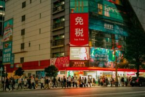 Vivid city lights illuminate bustling streets in Tokyo